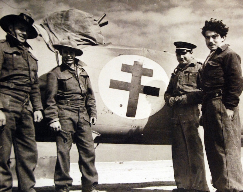 Two Australian soldiers and two French French airman stand alongside a Bristol Blenheim in north Africa, c. 1940. National Museum of the United States Navy. Public Domain.